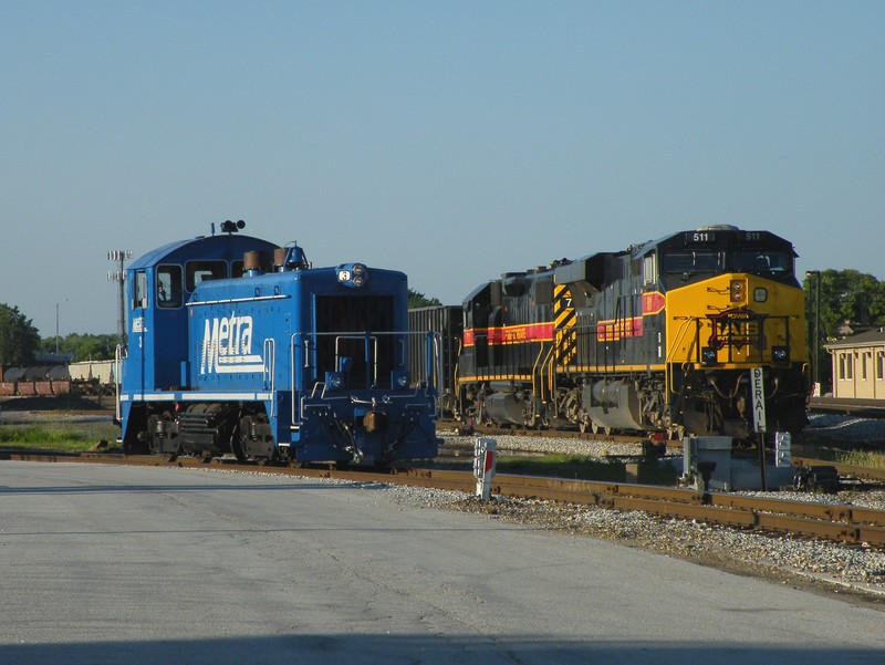 The seldom seen NIRC 3, the only SW1200 on Metra's roster, has permission out onto the main ahead of Iowa 511. 06-24-10