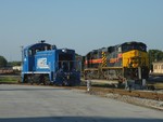 The seldom seen NIRC 3, the only SW1200 on Metra's roster, has permission out onto the main ahead of Iowa 511. 06-24-10