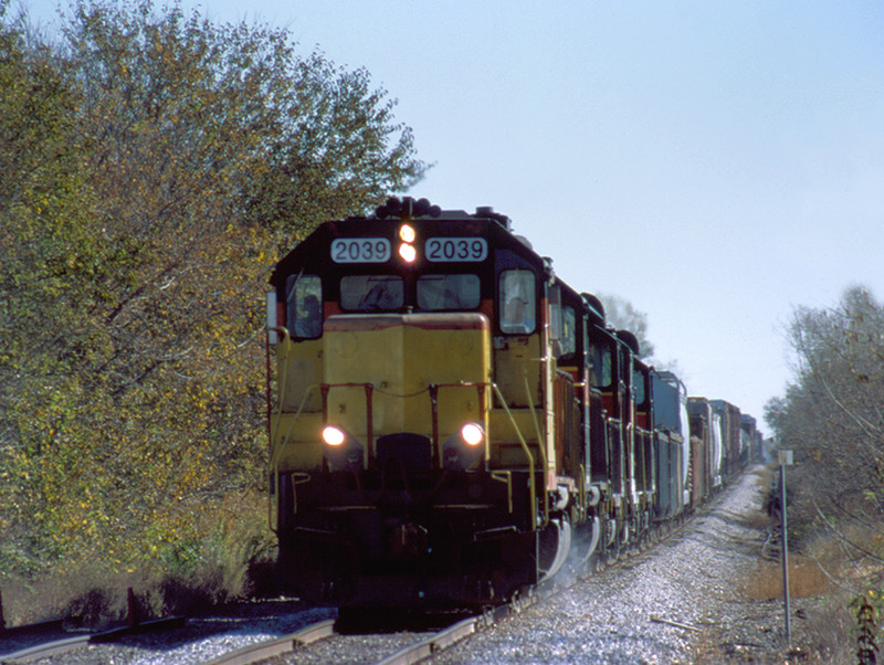 October 10, 2003 finds LLPX 2039 in faded Chessie colors running west at Davenport, Iowa with "BICB".