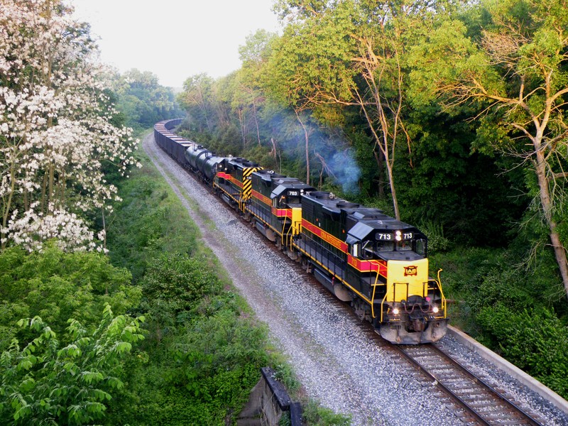 The first shot of the morning as the sun rises at 05:58; 713, 703, and 156 come into view with an extra RIBI made up of 3 blocks of sand cars for Ozinga in Mokena and stacks for Burr Oak. This was a "Oh S*@#" moment... and my resulting image is blurred and slightly over exposed... oh well!