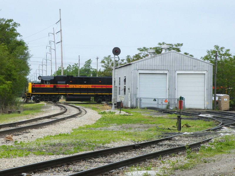 Now that the clouds have settled in, CSXT's J745 is clear of the main and Iowa 713 enters the Ottawa block and proceeds east across the Illinois Railway diamond in town.