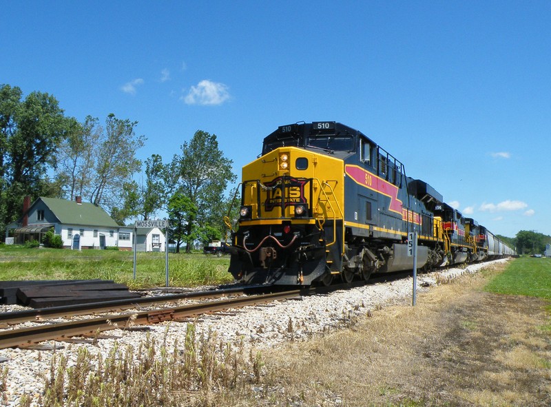 Back up to speed, the big power lerches and squeels as they roll south through Mossville.
