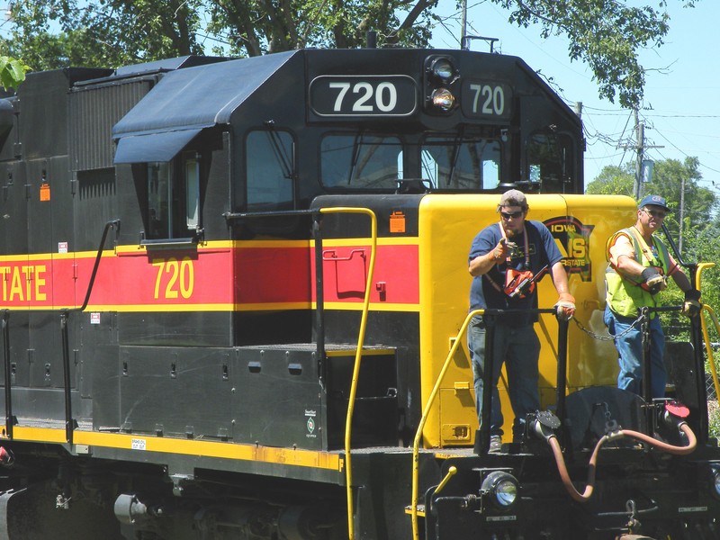 Conductors Vahey and Brown put on a hardass face as they ride 720 down the Buzzi spur.