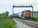 Strolling along at a modest 20 per YL rules... Iowa 513 strolls east through Rockdale. The illusion of a straight shot onto Metra territory will shortly die when Metra closes the door and the train sits for hours. 07-15-10