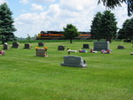 West train passes the Durant cemetery, June 7, 2006.