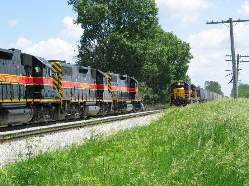 West train meets an extra eastbound at N. Star, June 7, 2006.