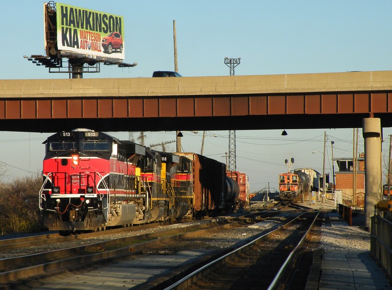 513 looks good in the late evening light as they yard a huge cut of cars off of CBBI in IHB's Riverdale Yd. IHB's Hump is off to the right, and a SW1500/Slug set is pulling a cut of cars down to start distributing them amongst the yard. 11-23-10