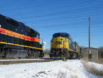 Iowa 704 east is tied down awaiting a new crew, while a late running CSX J745 does some work at Rockdale before heading west toward Ottawa. 12-13-10