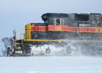 Conductor Vahey is busy copying a new warrant as snow swirls around the 155.