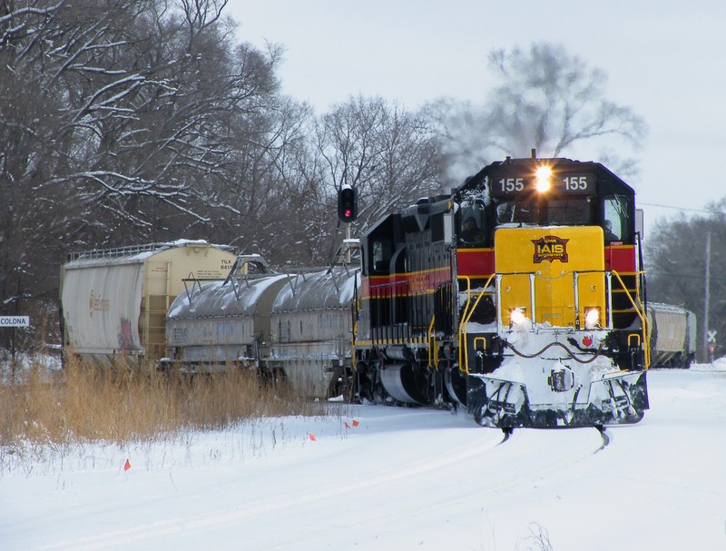 Negotiating Colona, the 155 west has orders to work with a BNSF crew switching at Silvis.