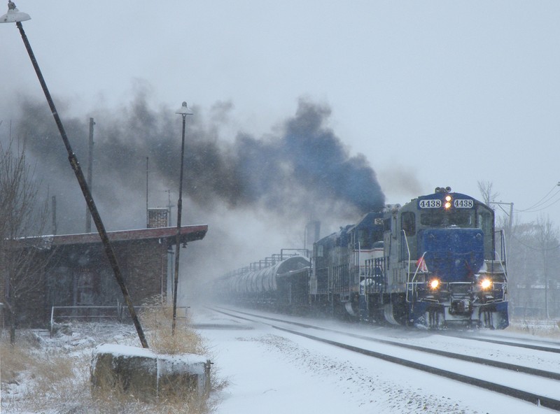 The RailLink has their interchange from the IAIS in tow, and are thundering north down the Rock main passed the old and decrepid 111th St Depot. 12-12-10