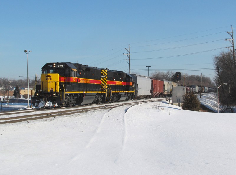 With no road power in Blue Island because of the storm, a pair of GP38-2's are in charge of a 118 car extra bound for Rock Island. The train is just underway, splitting the old tri-colors at Oak Forest, IL.