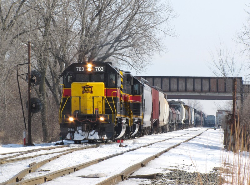 Passing under the old Joliet Junction, Iowa 703 west will cross over and take the industrial siding around Iowa 154 east,