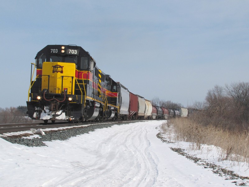 Up to track speed, this pair of GP38-2's are maxed out and up to 40 mph as the scream around a super elevated curve on the old Rock main coming into Minooka.