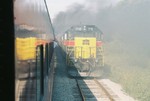 Westbound excursion train meets the eastbound, in the hole at Walcott siding, Sept. 15, 2006.