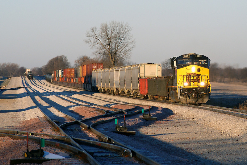 The CBBI rolls through the yard at South Amana early in the morning. On track 2 is the CBBI-24.