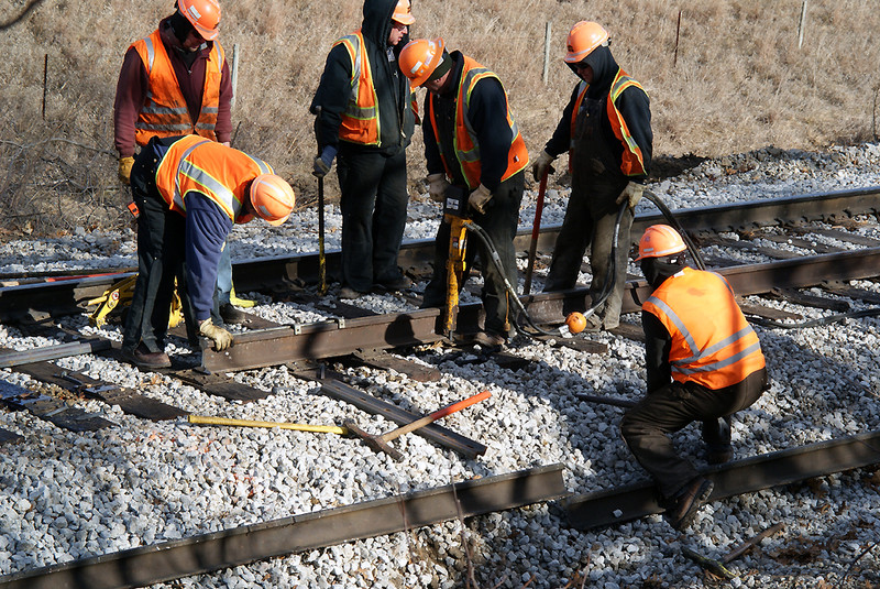 Driving spikes and getting ready to drill holes for joint.