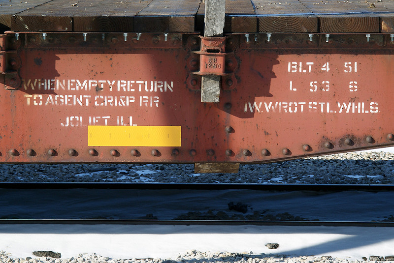 Ex CRIP now CIC MOW flat car on the siding in North Liberty. 61 years later the car is still in service.