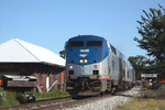 Now on Iowa Interstate rails, the Limited cranks it up a bit past the depot at Tiskilwa, Illinois.