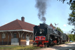 QJ 6988 pauses for the crew to snap some photos in front of the ex-RI Depot in Iowa City, Iowa.