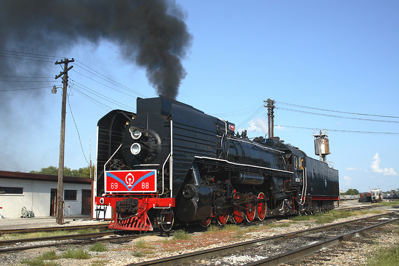 6988 has just ended the light run from Iowa City, here posing for a roster at IAIS' yard in Rock Island, Illinois.