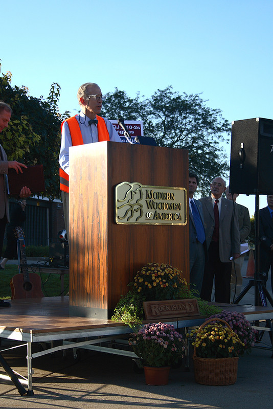 Speaking from the Modern Woodmen building in Rock Island, Illinois, Henry Posner kicks off the festivities for Riverway 2006, a celebration marking the 150th anniversary of the first railroad bridge to span the Mississippi River.