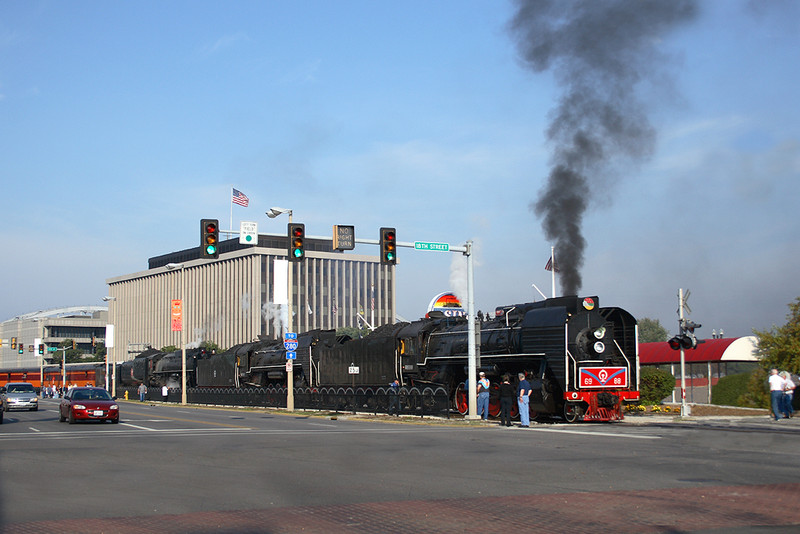 Day three of Riverway 2006 called for the two QJs and Milwaukee Road #261 to be rounded up for a tripleheaded steam run to Bureau, Illinois and return on IAIS rails. The train is seen here departing downtown Rock Island, Illinois September 16th, 2006.