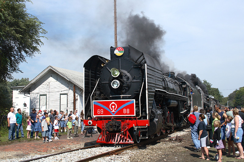 A view of the train reversing back onto the east-west main, passing the Bureau, Illinois depot. September 16th, 2006.