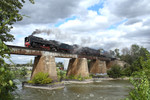 Crossing the Iowa River at Iowa City westbound on 9/18/06. Once at Newton, the engines will be stored until their next venture.