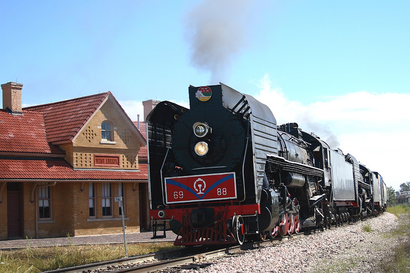 IAIS 6988 West brings BICB past the ex-RI depot at West liberty, Iowa September 18th, 2006.