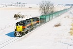 709 followed by 24 Inobrasa hoppers drags the BICB under the Highway 6 bridge west of Ladora, Iowa on February 10, 2008.