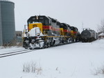 Westbound turn passes storage cars at the Wilton house track, Feb. 11, 2008.