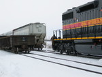 Coupling back onto their train after setting scrap loads to the siding.