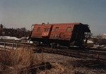 The result of a Milwaukee steel side caboose parked to close to a switch.
