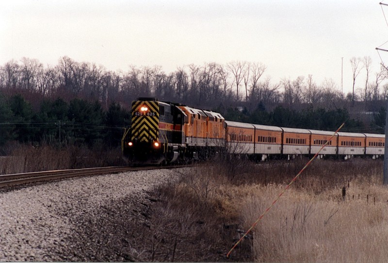 The Hawkeye Express Ski Train leaves Coralville/Iowa City for the last time in late November of 2005 with GP38 625 running long hood forward. West of Tiffin. Iowa.