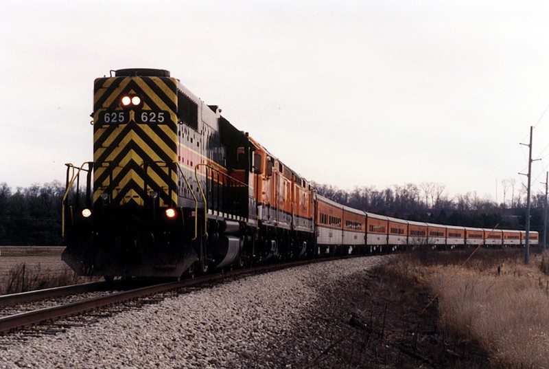 The Hawkeye Express Ski Train leaves Coralville/Iowa City for the last time in late November of 2005 with GP38 625 running long hood forward. West of Tiffin. Iowa.