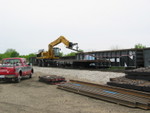 After the turn has gone by, the track gang transloads rails into gons parked at Atalissa, May 9, 2008.