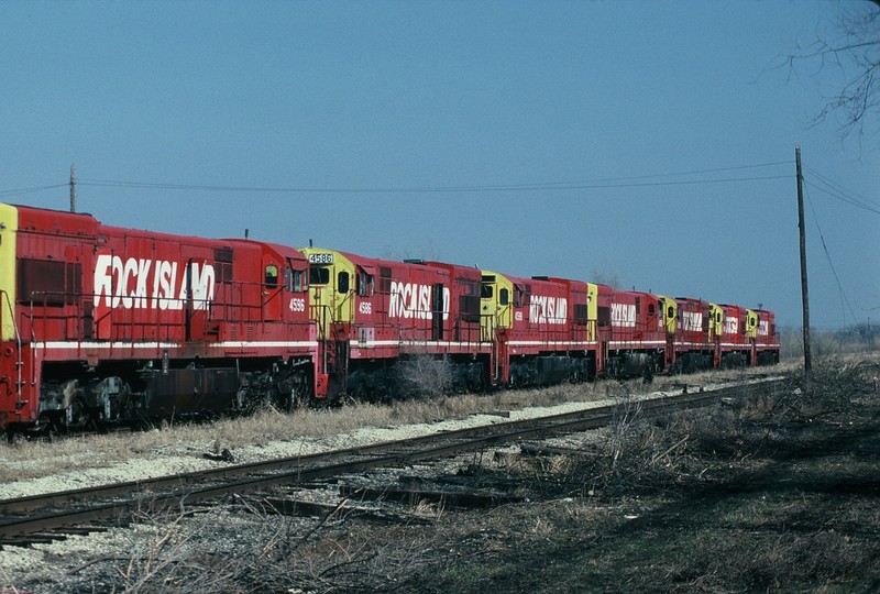 The only six axle GE's owned by the Rock Island await their fate at Silvis in this 26-March-1989 photo. What a surprise to find them, but sad to see their condition.