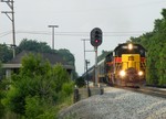 IAIS 700 leads BICB through the tri-color signals at Oak Forest with the company cars, two KRL heavy duty flats, and a ethanol train in tow. 06-07-09