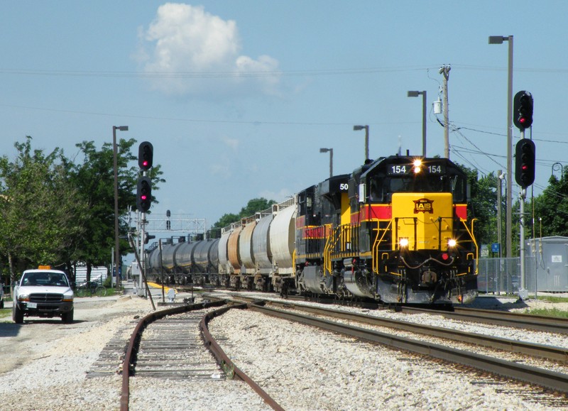 RIBI led by 154 and 509 thunder through downtown Mokena with extra tonnage from Cedar Rapids and Rock Island. 06-25-09