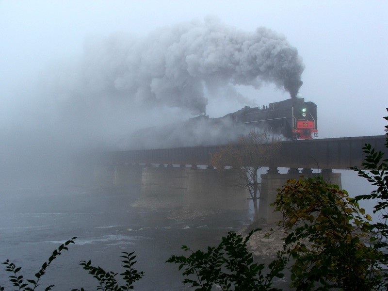 The two steamers emerge from the dense fog and into Moscow as they chug across the Cedar River.