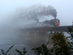 The two steamers emerge from the dense fog and into Moscow as they chug across the Cedar River.