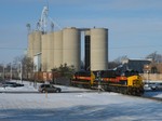 Iowa 505 leads 704 on a recrewed CBBI through the frosty town of Minooka. The snow really exaggerates how good this paint scheme looks! 01-08-09