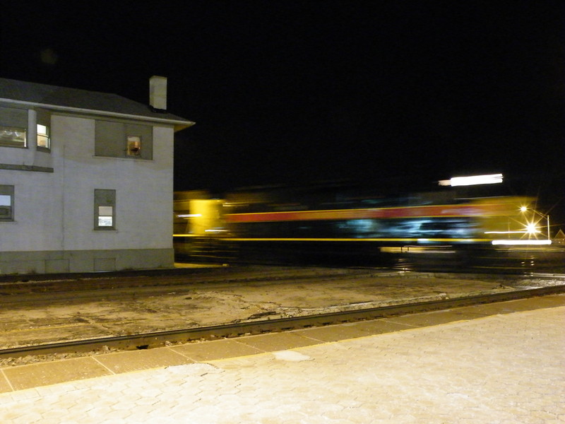 Iowa 718 and a 500 scoot across the diamonds at Joliet UD tower with a BICB manifest. 02-28-09