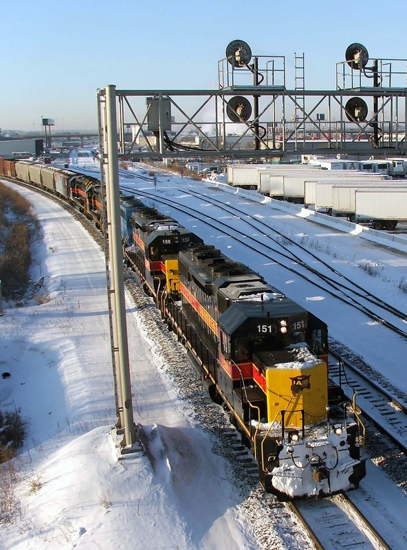 The five EMD's duck under one of the new;y modified signal bridges on the line, thankfully when they scrapped the cantilever that once stood here, they kept all the searchlights!