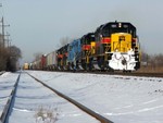 Just south of IHB C.P. Chicago Ridge where the old N&W, now Metra Southwest Service, crosses the IHB, BNSF F BAIMCI trundles along at a measely 15 mph...