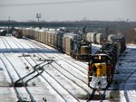 Another view of the Iowa detour taking headroom out of the east yard at Riverdale. In the background, a Harbor yard job works and a CSXT auto train waits from the Harbor crew to get ut of the way.