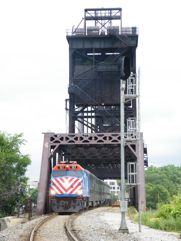 Metra's Managers Special pops out of Bridge 407 and pauses allowing the official Metra photographer and his assistant for the day get the shot.