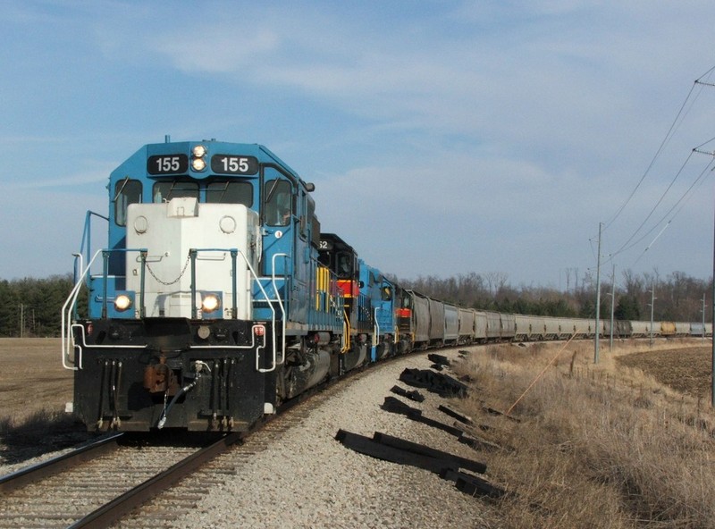 Iowa 155 glides through Kent Park curve in route to Cedar Rapids with ICCR. At the time we were beyond frustrated that the stupid blue bombs were leading and ruining the consist, but now it doesn't seem so bad since they are gone.