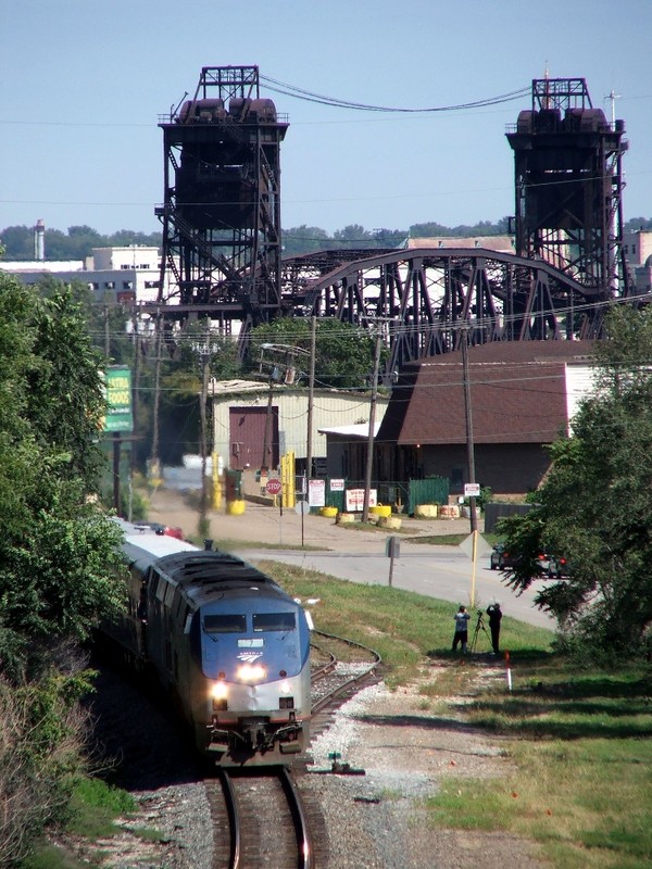 The train is finally back underway coming into the town of Rockdale, as viewed from I-80.